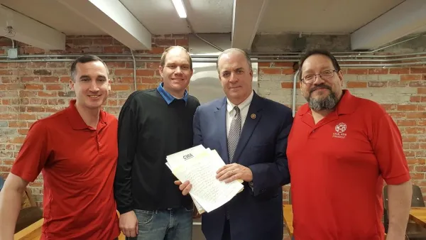 charles_daniels_pres_4123_jacob_vick_pres_4103_congressman_kildee_and_rainer_delgado_pres_4108_deliver_handwritten_letters.jpg